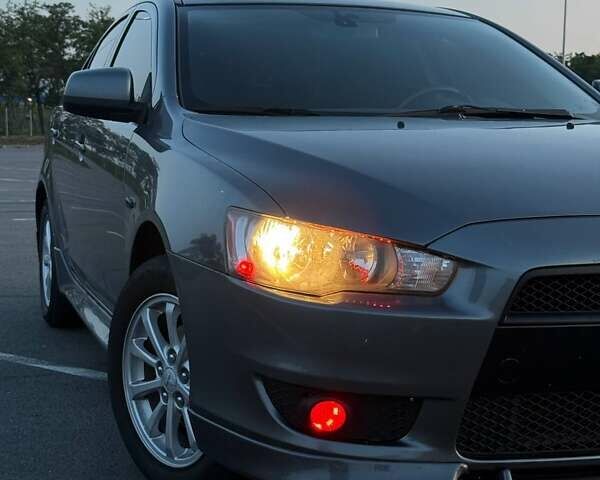 Серый Мицубиси Лансер, объемом двигателя 2 л и пробегом 191 тыс. км за 7900 $, фото 3 на Automoto.ua