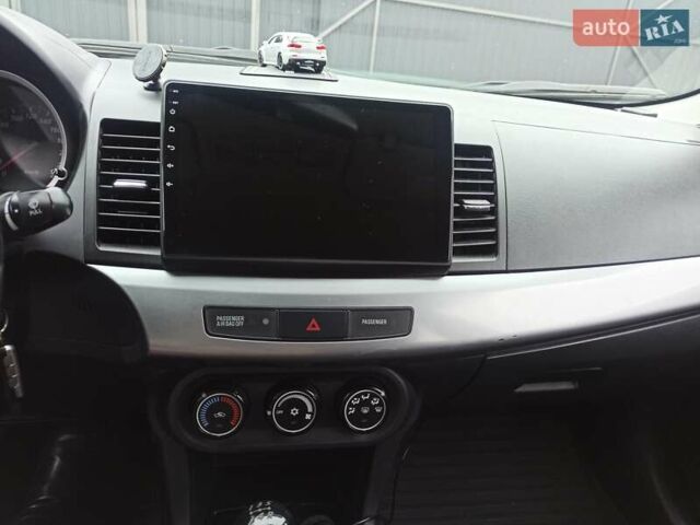 Сірий Міцубісі Lancer, об'ємом двигуна 1.5 л та пробігом 255 тис. км за 7500 $, фото 11 на Automoto.ua