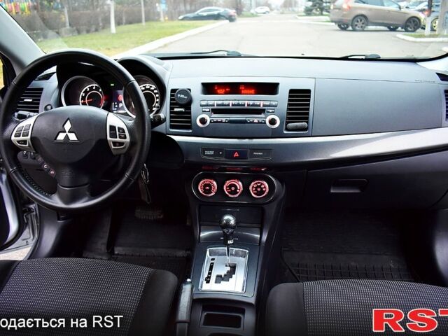 Серый Мицубиси Лансер, объемом двигателя 2 л и пробегом 178 тыс. км за 7400 $, фото 6 на Automoto.ua