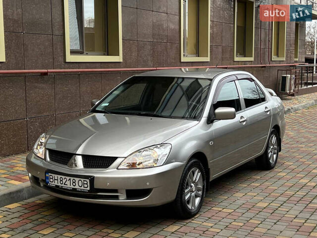 Сірий Міцубісі Lancer, об'ємом двигуна 1.58 л та пробігом 180 тис. км за 6000 $, фото 7 на Automoto.ua