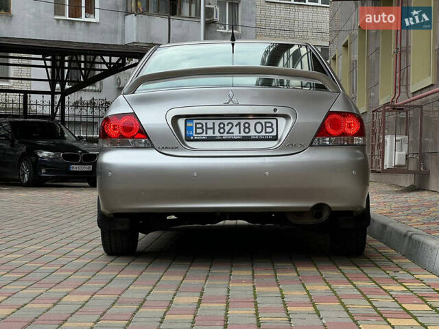 Сірий Міцубісі Lancer, об'ємом двигуна 1.58 л та пробігом 180 тис. км за 6000 $, фото 29 на Automoto.ua