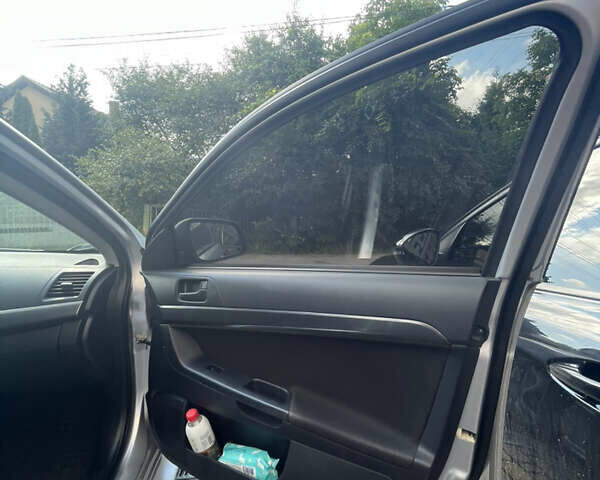 Мицубиси Лансер 2011 в Львове на Automoto.ua Серый Мицубиси Лансер, объемом двигателя 2 л и пробегом 104 тыс. км за 10500 $, фото 42 на Automoto.ua