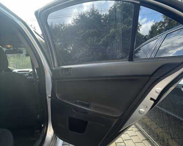 Мицубиси Лансер 2011 в Львове на Automoto.ua Серый Мицубиси Лансер, объемом двигателя 2 л и пробегом 104 тыс. км за 10500 $, фото 44 на Automoto.ua