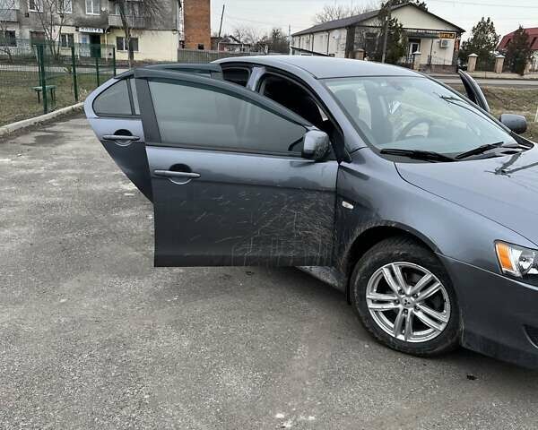 Серый Мицубиси Лансер, объемом двигателя 2 л и пробегом 217 тыс. км за 8500 $, фото 14 на Automoto.ua