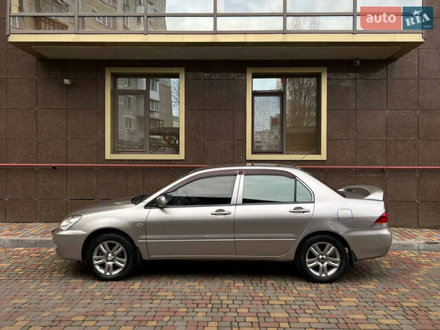 Сірий Міцубісі Lancer, об'ємом двигуна 1.58 л та пробігом 180 тис. км за 6000 $, фото 40 на Automoto.ua