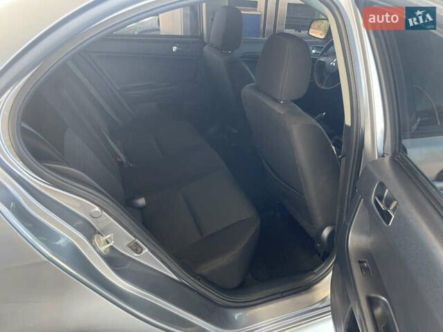 Серый Мицубиси Лансер, объемом двигателя 1.6 л и пробегом 183 тыс. км за 7400 $, фото 11 на Automoto.ua