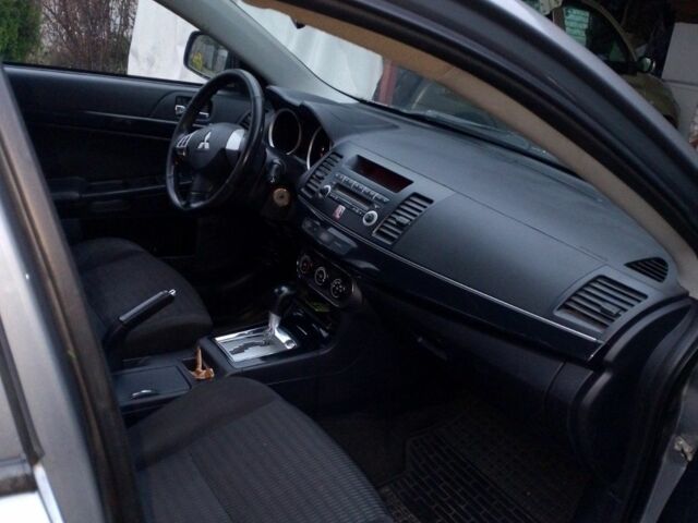 Серый Мицубиси Лансер, объемом двигателя 1.6 л и пробегом 140 тыс. км за 6500 $, фото 5 на Automoto.ua