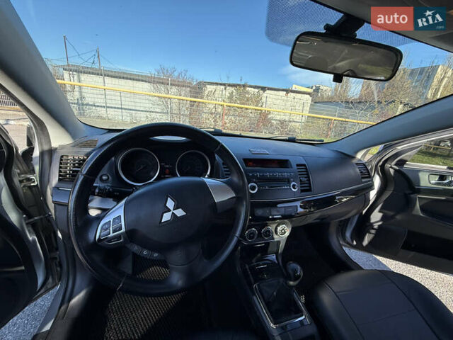 Серый Мицубиси Лансер, объемом двигателя 1.6 л и пробегом 188 тыс. км за 7400 $, фото 19 на Automoto.ua