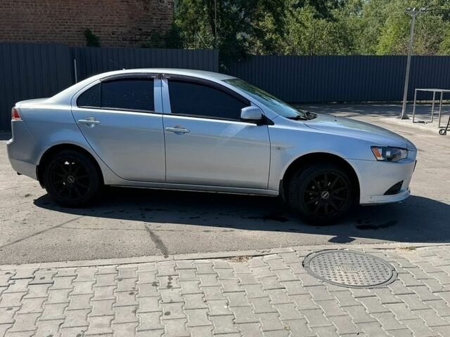 Сірий Міцубісі Lancer, об'ємом двигуна 1.59 л та пробігом 213 тис. км за 6900 $, фото 3 на Automoto.ua