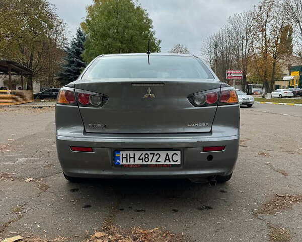 Серый Мицубиси Лансер, объемом двигателя 2 л и пробегом 170 тыс. км за 7400 $, фото 4 на Automoto.ua