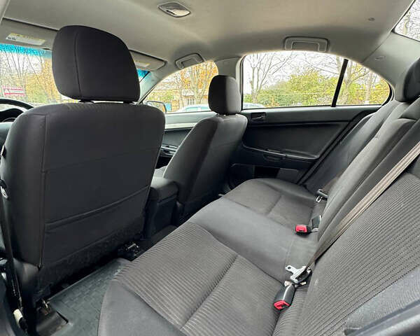 Серый Мицубиси Лансер, объемом двигателя 2 л и пробегом 170 тыс. км за 7400 $, фото 24 на Automoto.ua