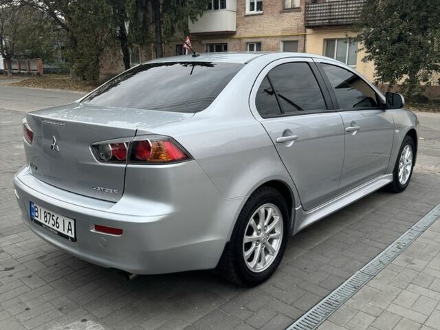 Серый Мицубиси Лансер, объемом двигателя 1.6 л и пробегом 85 тыс. км за 7400 $, фото 4 на Automoto.ua