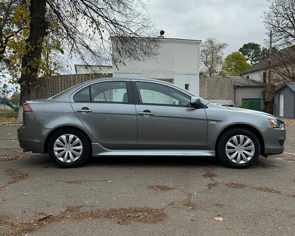 Серый Мицубиси Лансер, объемом двигателя 2 л и пробегом 170 тыс. км за 7400 $, фото 6 на Automoto.ua