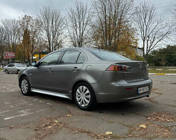 Серый Мицубиси Лансер, объемом двигателя 2 л и пробегом 170 тыс. км за 7400 $, фото 3 на Automoto.ua