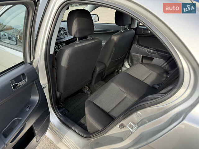 Сірий Міцубісі Lancer, об'ємом двигуна 1.6 л та пробігом 205 тис. км за 7900 $, фото 13 на Automoto.ua