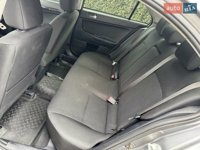 Сірий Міцубісі Lancer, об'ємом двигуна 1.6 л та пробігом 65 тис. км за 9500 $, фото 12 на Automoto.ua