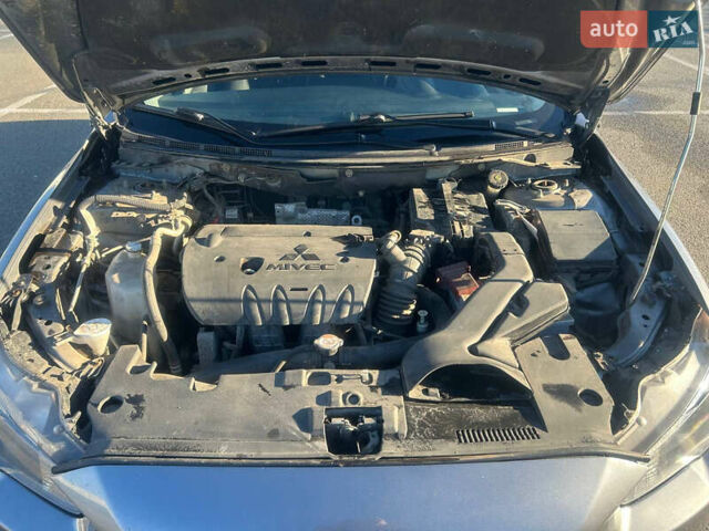 Сірий Міцубісі Lancer, об'ємом двигуна 2 л та пробігом 140 тис. км за 7800 $, фото 12 на Automoto.ua