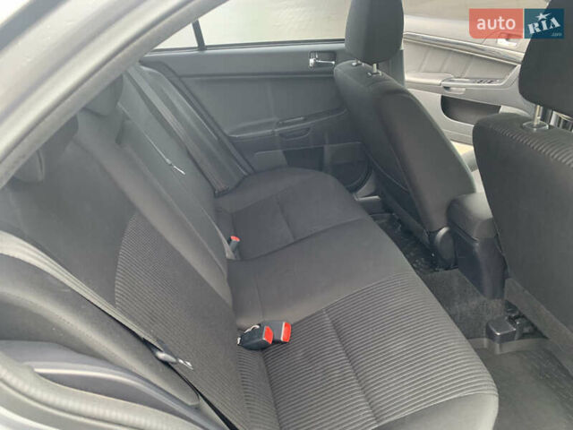 Серый Мицубиси Лансер, объемом двигателя 1.59 л и пробегом 83 тыс. км за 9900 $, фото 31 на Automoto.ua