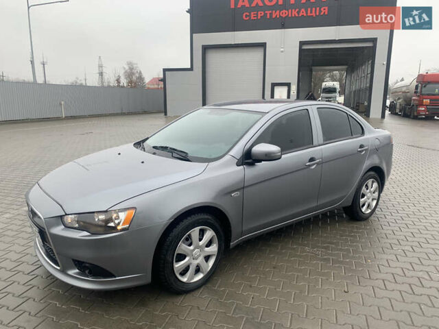 Серый Мицубиси Лансер, объемом двигателя 1.59 л и пробегом 83 тыс. км за 9900 $, фото 1 на Automoto.ua