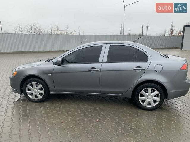Серый Мицубиси Лансер, объемом двигателя 1.59 л и пробегом 83 тыс. км за 9900 $, фото 17 на Automoto.ua