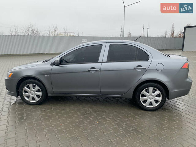 Серый Мицубиси Лансер, объемом двигателя 1.59 л и пробегом 83 тыс. км за 9900 $, фото 18 на Automoto.ua