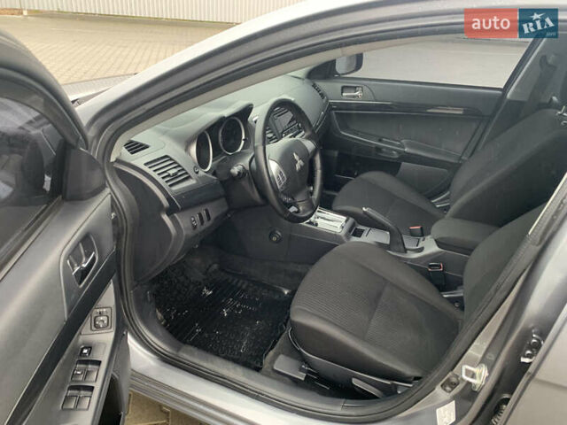 Серый Мицубиси Лансер, объемом двигателя 1.59 л и пробегом 83 тыс. км за 9900 $, фото 24 на Automoto.ua