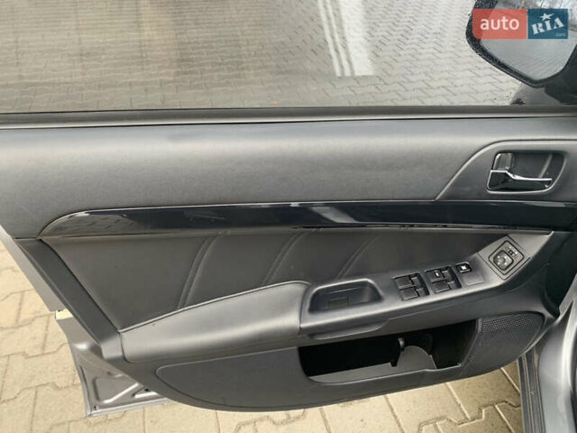 Серый Мицубиси Лансер, объемом двигателя 1.59 л и пробегом 83 тыс. км за 9900 $, фото 25 на Automoto.ua