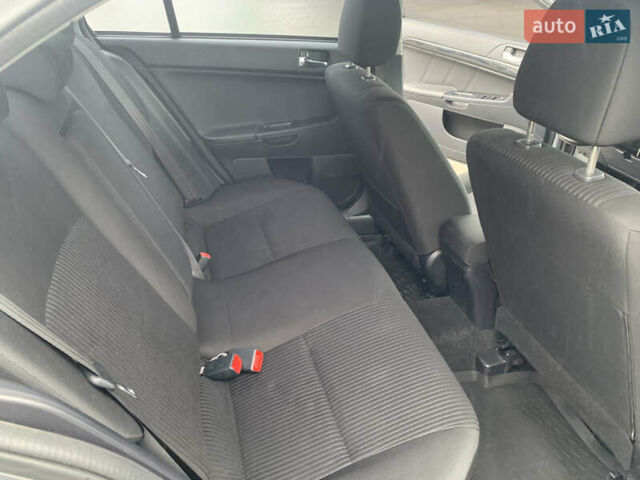 Серый Мицубиси Лансер, объемом двигателя 1.59 л и пробегом 83 тыс. км за 9900 $, фото 26 на Automoto.ua