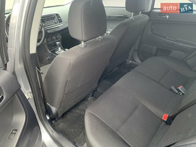 Серый Мицубиси Лансер, объемом двигателя 1.59 л и пробегом 83 тыс. км за 9900 $, фото 32 на Automoto.ua