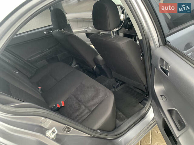 Серый Мицубиси Лансер, объемом двигателя 1.59 л и пробегом 83 тыс. км за 9900 $, фото 27 на Automoto.ua