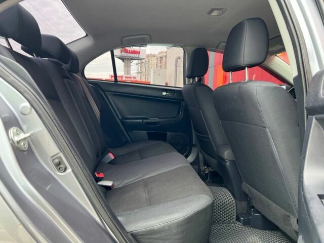 Серый Мицубиси Лансер, объемом двигателя 2 л и пробегом 170 тыс. км за 9500 $, фото 10 на Automoto.ua