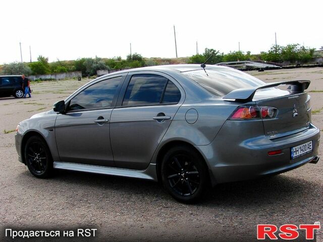 Серый Мицубиси Лансер, объемом двигателя 2 л и пробегом 85 тыс. км за 9700 $, фото 7 на Automoto.ua