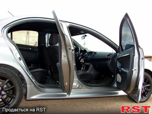 Серый Мицубиси Лансер, объемом двигателя 2 л и пробегом 85 тыс. км за 9700 $, фото 11 на Automoto.ua