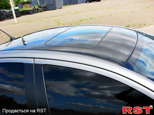 Серый Мицубиси Лансер, объемом двигателя 2 л и пробегом 85 тыс. км за 9700 $, фото 4 на Automoto.ua