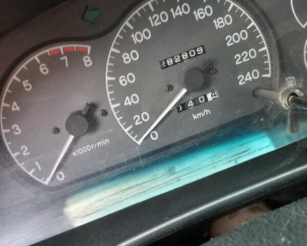 Серый Мицубиси Лансер, объемом двигателя 1.6 л и пробегом 282 тыс. км за 2401 $, фото 9 на Automoto.ua