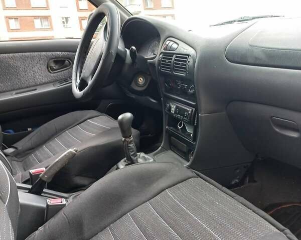 Серый Мицубиси Лансер, объемом двигателя 1.6 л и пробегом 282 тыс. км за 2401 $, фото 4 на Automoto.ua