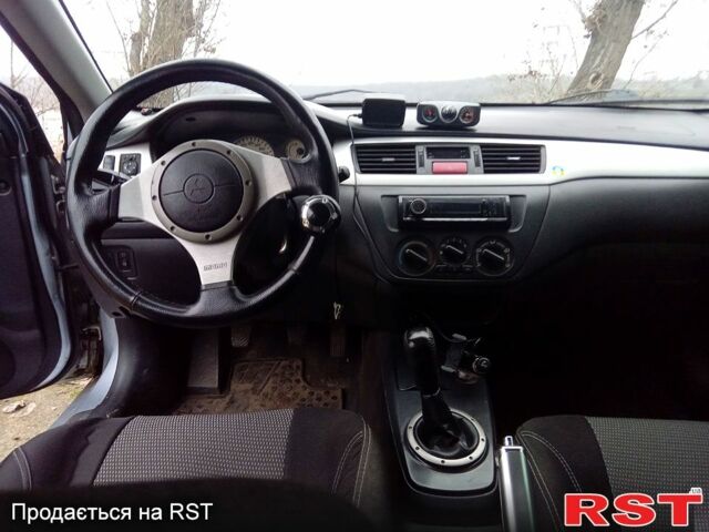 Серый Мицубиси Лансер, объемом двигателя 2 л и пробегом 352 тыс. км за 3950 $, фото 13 на Automoto.ua