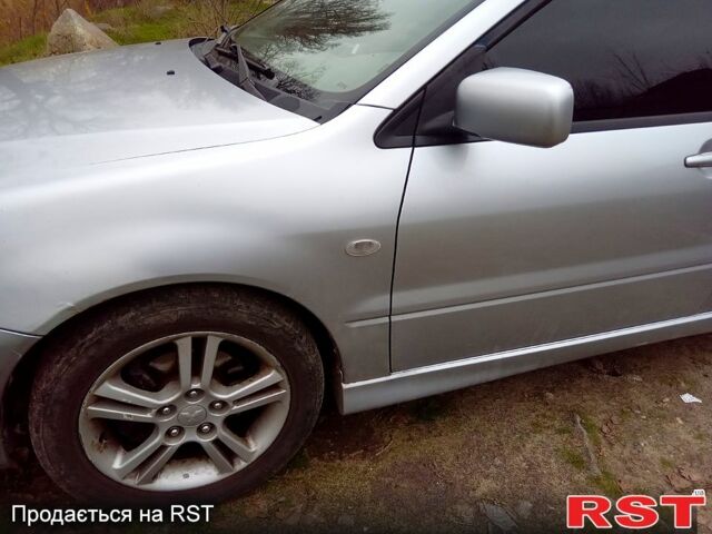 Серый Мицубиси Лансер, объемом двигателя 2 л и пробегом 352 тыс. км за 3950 $, фото 5 на Automoto.ua