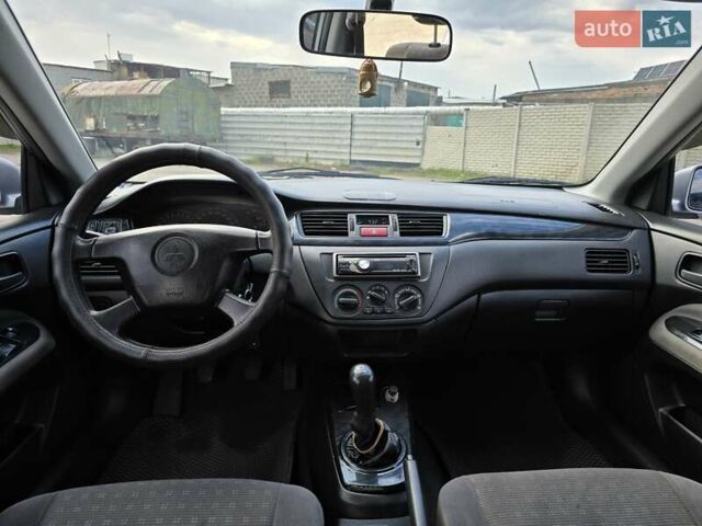 Сірий Міцубісі Lancer, об'ємом двигуна 1.6 л та пробігом 244 тис. км за 4300 $, фото 9 на Automoto.ua