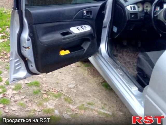 Серый Мицубиси Лансер, объемом двигателя 2 л и пробегом 352 тыс. км за 3950 $, фото 10 на Automoto.ua