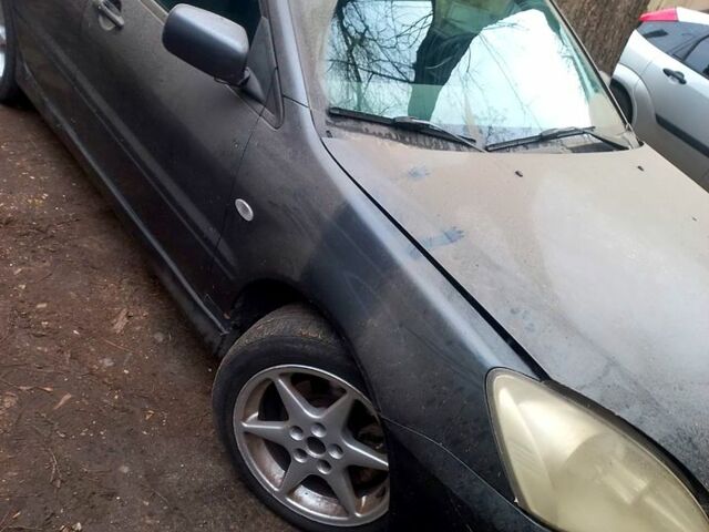 Серый Мицубиси Лансер, объемом двигателя 1.6 л и пробегом 234 тыс. км за 2500 $, фото 5 на Automoto.ua