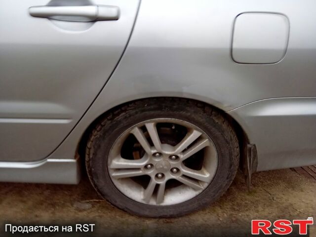 Серый Мицубиси Лансер, объемом двигателя 2 л и пробегом 352 тыс. км за 3950 $, фото 6 на Automoto.ua