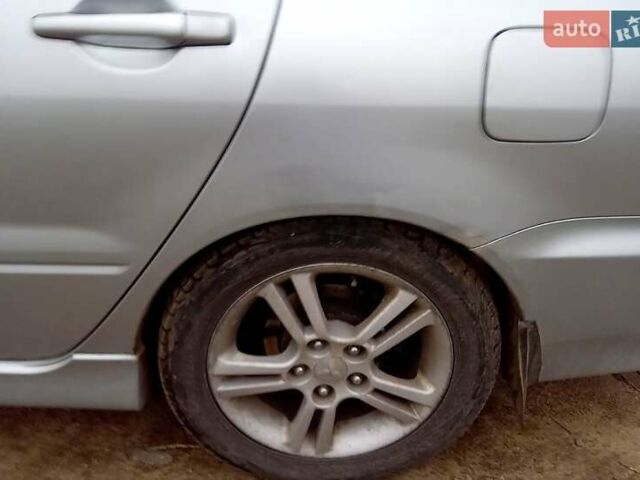 Сірий Міцубісі Lancer, об'ємом двигуна 2 л та пробігом 352 тис. км за 3950 $, фото 5 на Automoto.ua