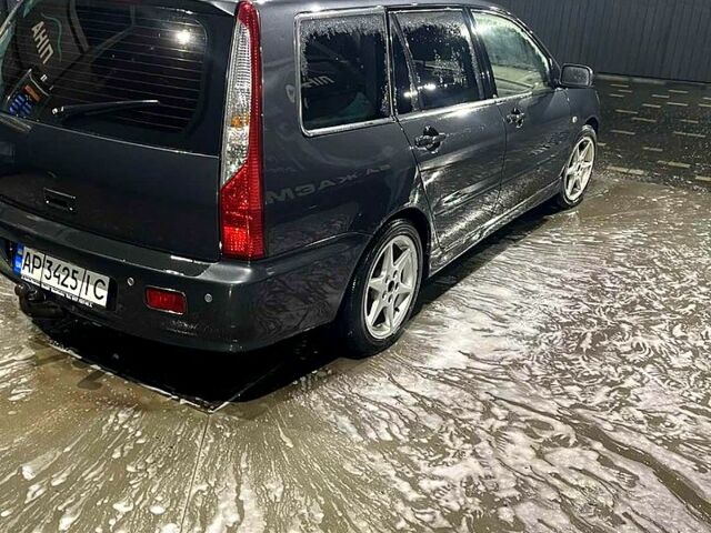 Серый Мицубиси Лансер, объемом двигателя 1.6 л и пробегом 234 тыс. км за 2500 $, фото 2 на Automoto.ua