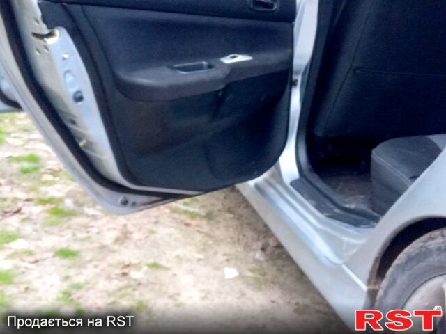 Серый Мицубиси Лансер, объемом двигателя 2 л и пробегом 352 тыс. км за 3950 $, фото 12 на Automoto.ua