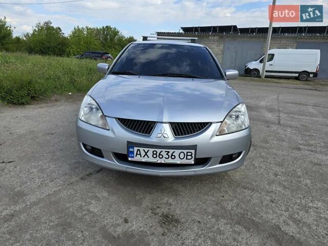 Сірий Міцубісі Lancer, об'ємом двигуна 1.6 л та пробігом 244 тис. км за 4300 $, фото 2 на Automoto.ua