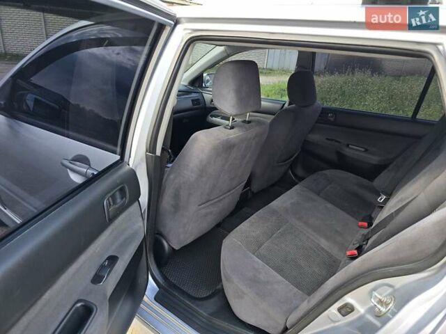 Сірий Міцубісі Lancer, об'ємом двигуна 1.6 л та пробігом 244 тис. км за 4300 $, фото 5 на Automoto.ua