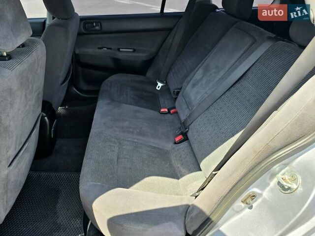 Сірий Міцубісі Lancer, об'ємом двигуна 1.6 л та пробігом 246 тис. км за 4300 $, фото 14 на Automoto.ua