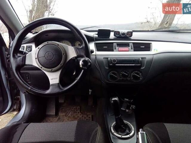 Сірий Міцубісі Lancer, об'ємом двигуна 2 л та пробігом 352 тис. км за 3950 $, фото 12 на Automoto.ua