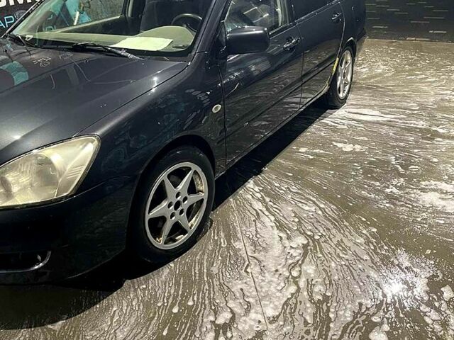 Серый Мицубиси Лансер, объемом двигателя 1.6 л и пробегом 234 тыс. км за 2500 $, фото 1 на Automoto.ua